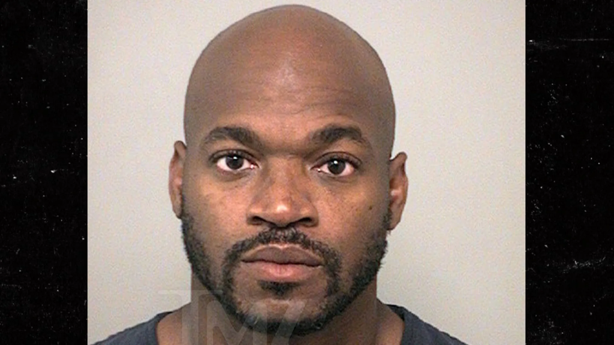 NFL Star Adrian Peterson's Mug Shot: Stoic Face, Not-So-Stoic Choices!