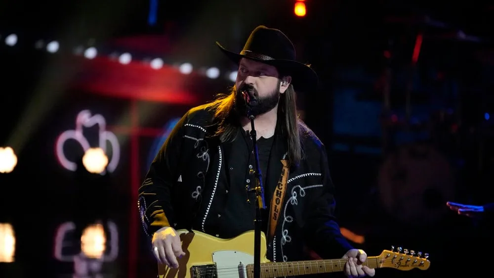 Aaron Nichols Ignites The Voice Stage with a Luke Combs Cover: Will He Make the Finals?