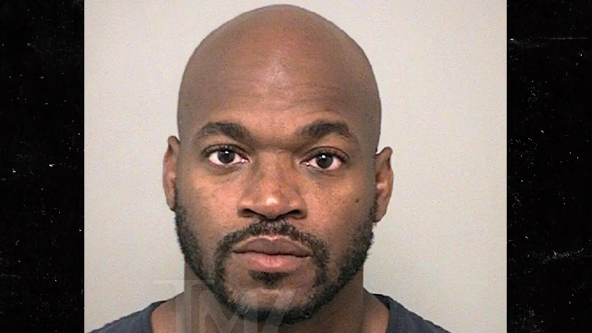 NFL Star Adrian Peterson's Mug Shot: Stoic Face, Not-So-Stoic Choices!