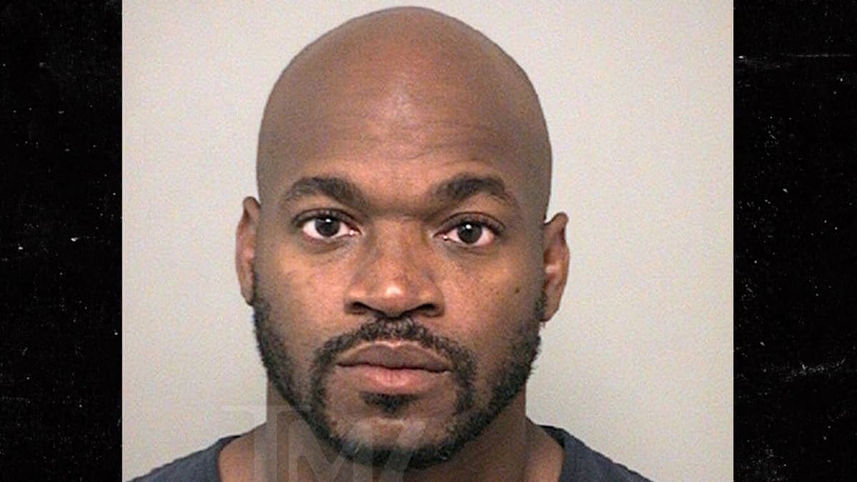 NFL Star Adrian Peterson's Mug Shot: Stoic Face, Not-So-Stoic Choices!